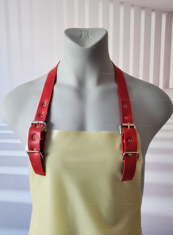 A latex apron with transparent material and bold red straps, designed for the kinky community.