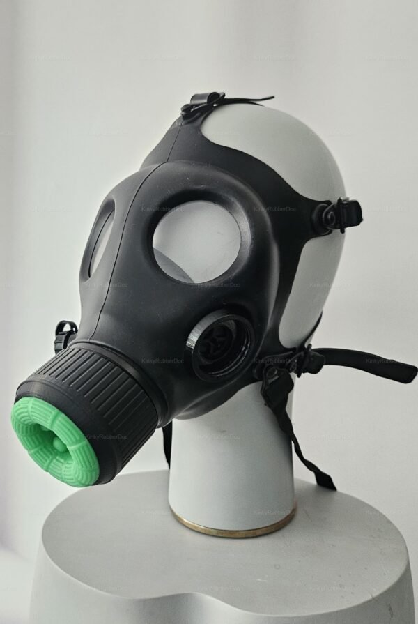 Black latex mask with a green silicone mouth insert, designed for a bold and edgy fetish look.