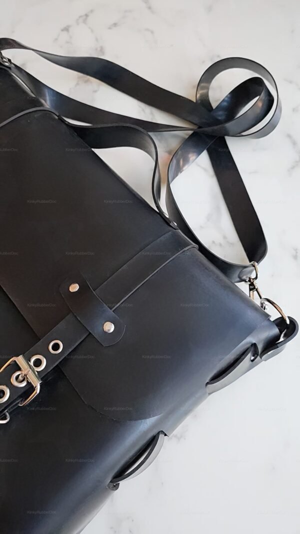 Sleek black latex rubber tote bag with a stylish belt accent, perfect for adding an edgy touch to any ensemble.