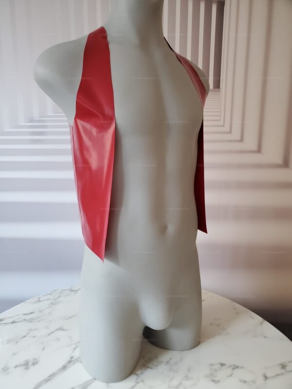 Red latex vest with open front and laced back design, displayed on a sleek marble surface.