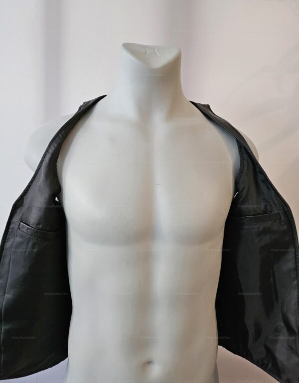**Alt Text**: Sleek black leather vest open over a bare chest.