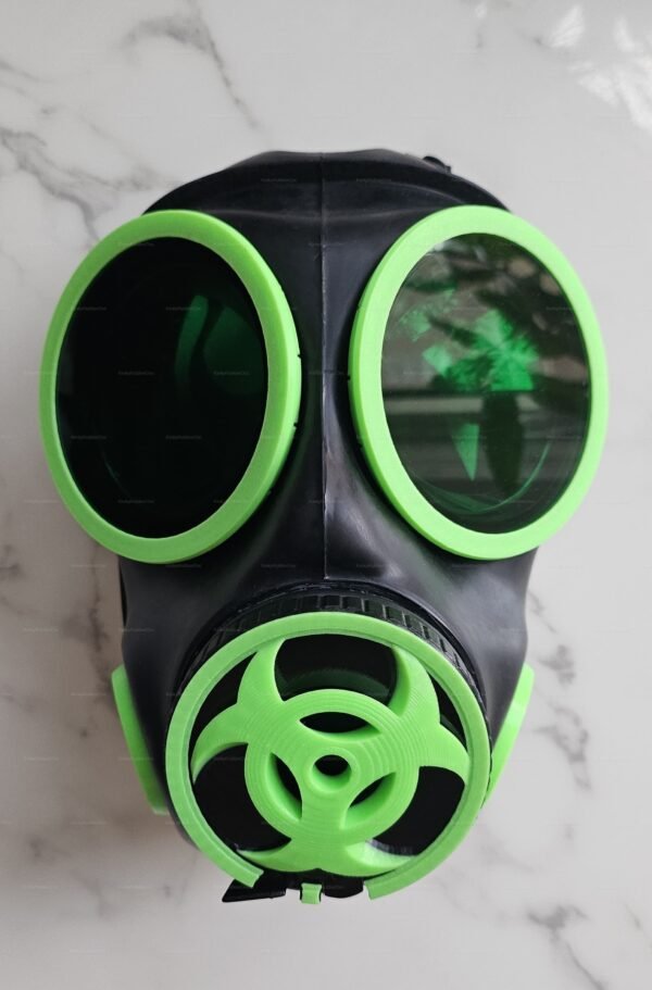 A striking black gas mask with vibrant green acrylic lenses, designed for a bold and edgy look.