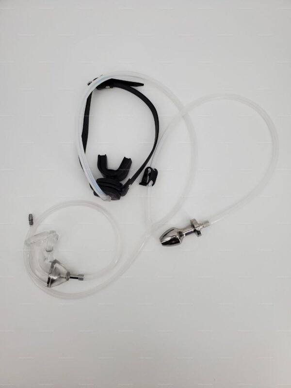 A fetish gear set featuring a penis catheter connected to a mouth gag with clear tubing, crafted from sleek metal and soft silicone materials.