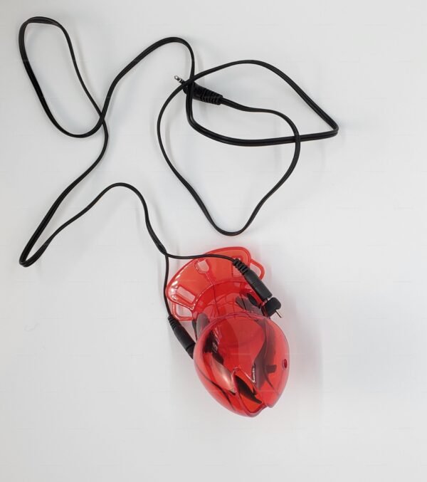 Red plastic chastity electro kit with connecting cables for adult fetish play.