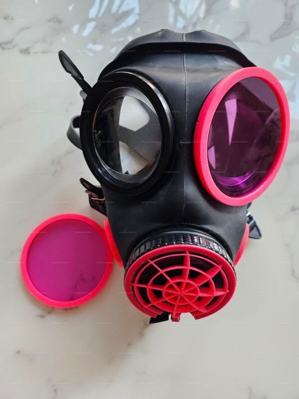 Edgy black mask with striking red-pink accents and removable lens.