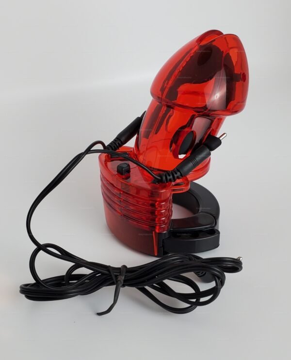 A striking red plastic e-stim cock cage with sleek black accents and attached wires for electrifying sensations.