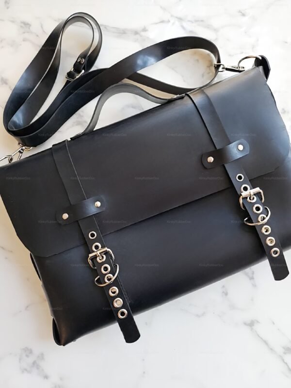 Sleek black rubber crossbody bag with silver hardware and adjustable strap, ideal for fetish fashion.