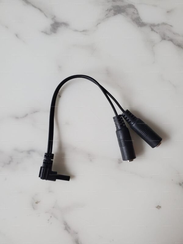 A sleek, black TENS to DC 2.5mm Splitter adapter designed for versatile connectivity in fetish gear setups.